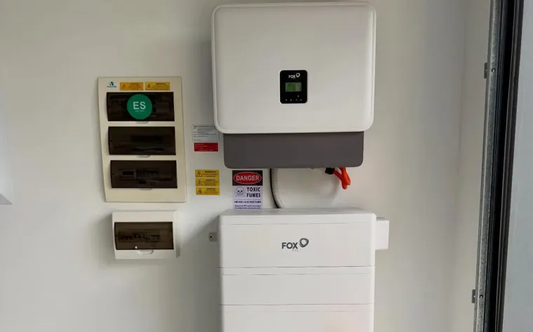 FoxESS inverter and battery installed on a garage wall