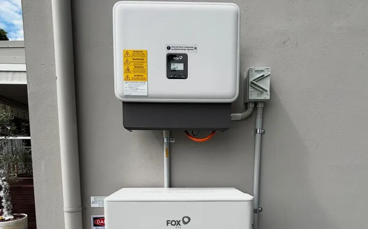 FoxESS inverter and battery installed on a rendered house wall